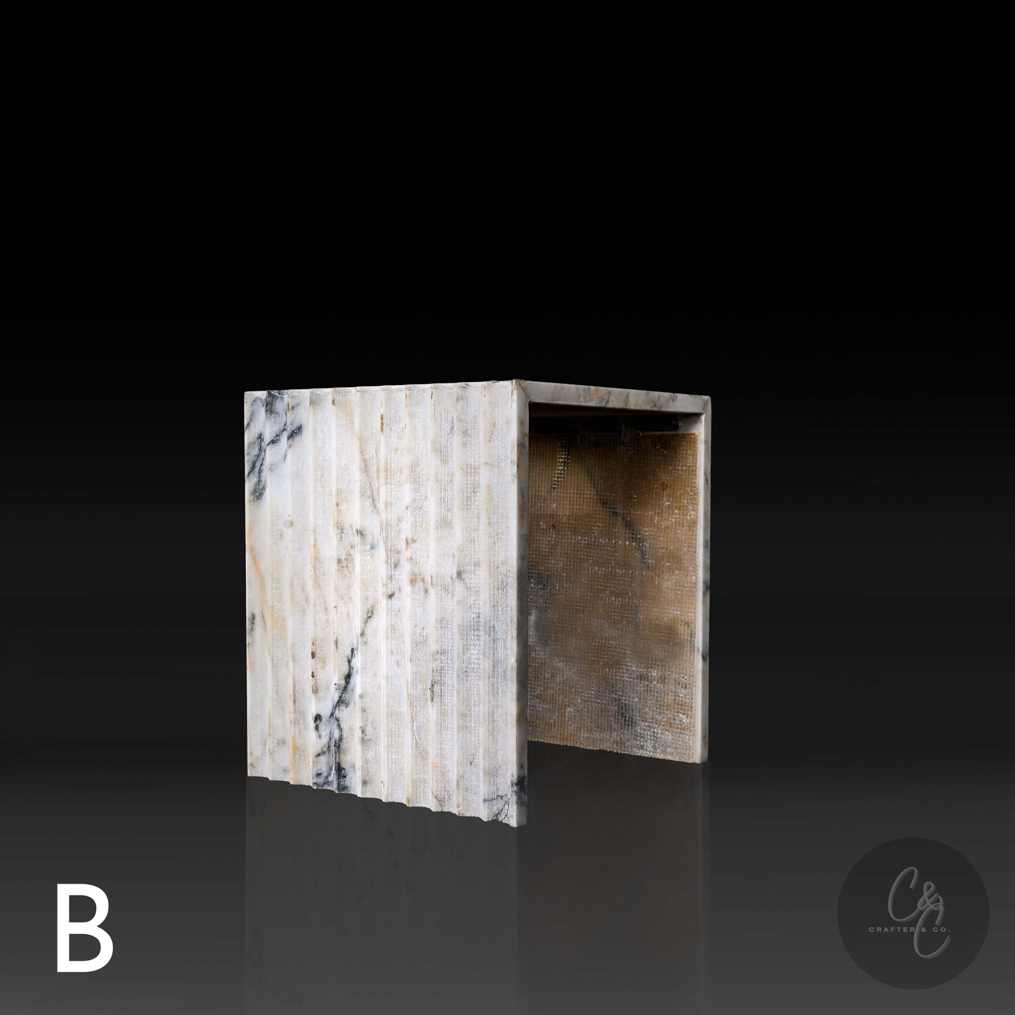 Calacatta Monet marble corrugated coffee table angled profile, luxury handcrafted stone design