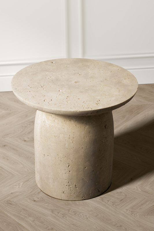 "Eminence travertine side table with a smooth round top and rectangular oval base."