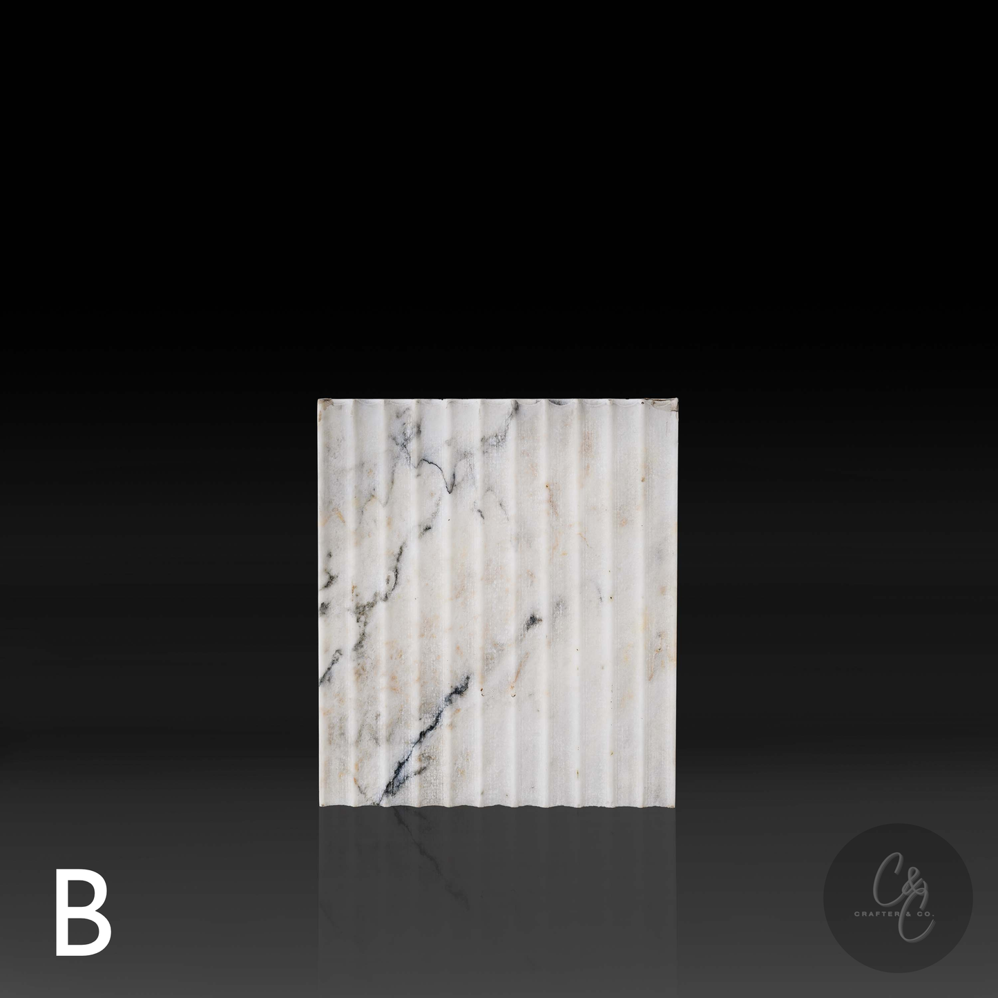 Calacatta Monet marble corrugated side table side view, handcrafted Italian stone furniture with gold and grey veining