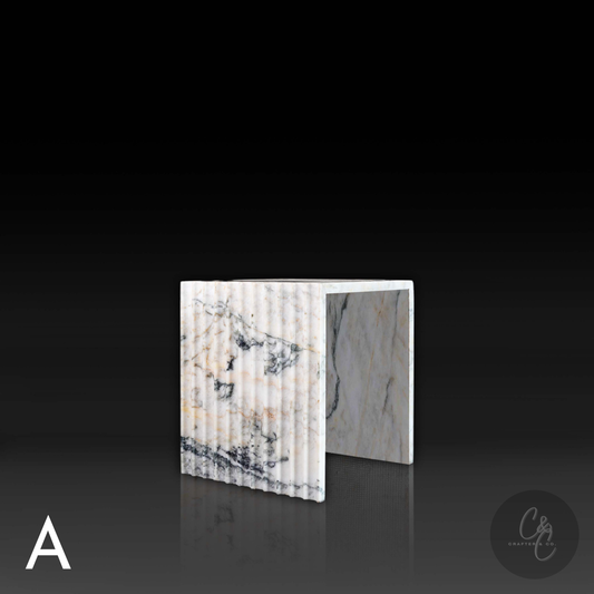 Calacatta Monet marble corrugated coffee table angled profile, luxury handcrafted stone design.