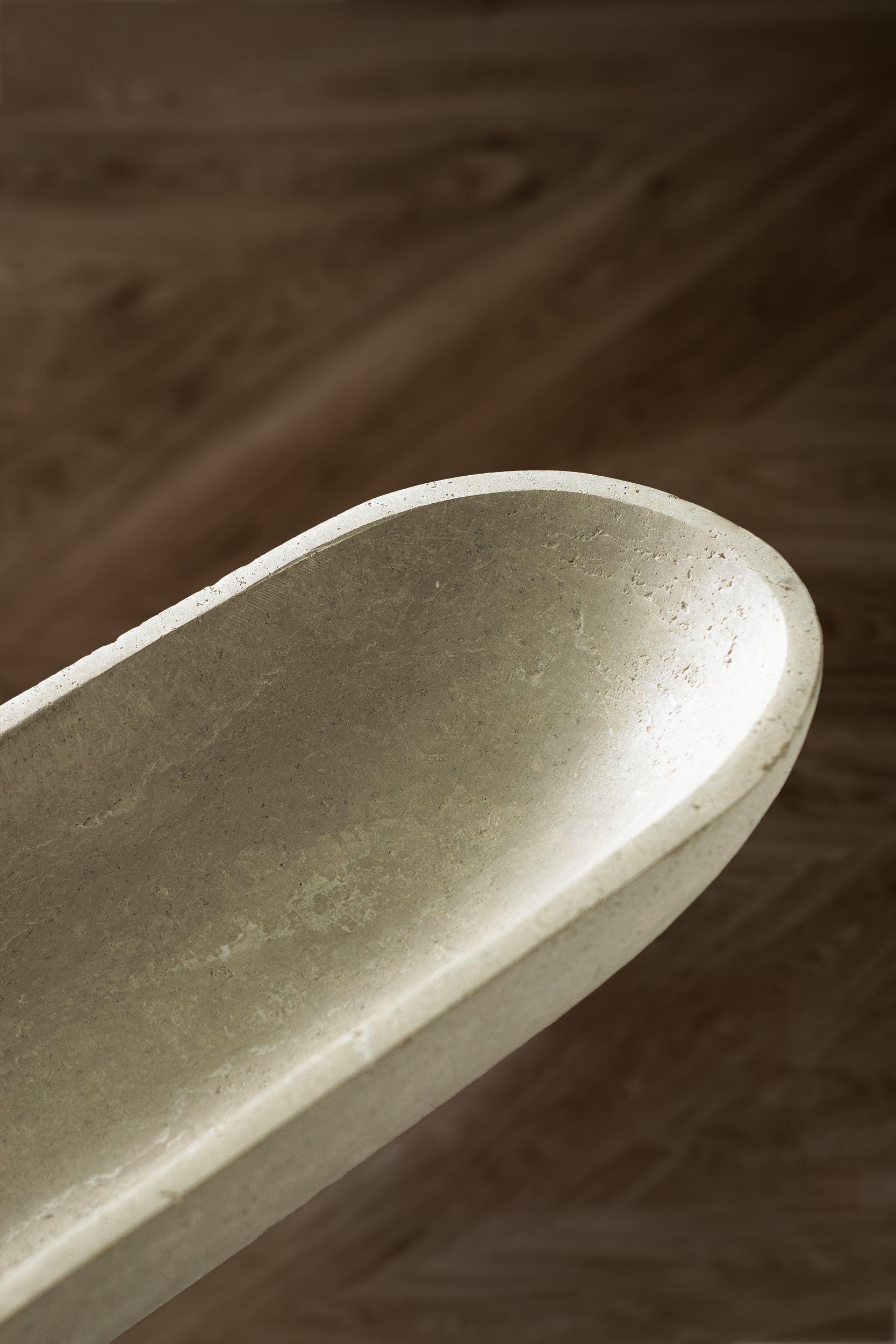 Serenity Oval Bowl in Travertine showcasing smooth polished surface and natural veining.