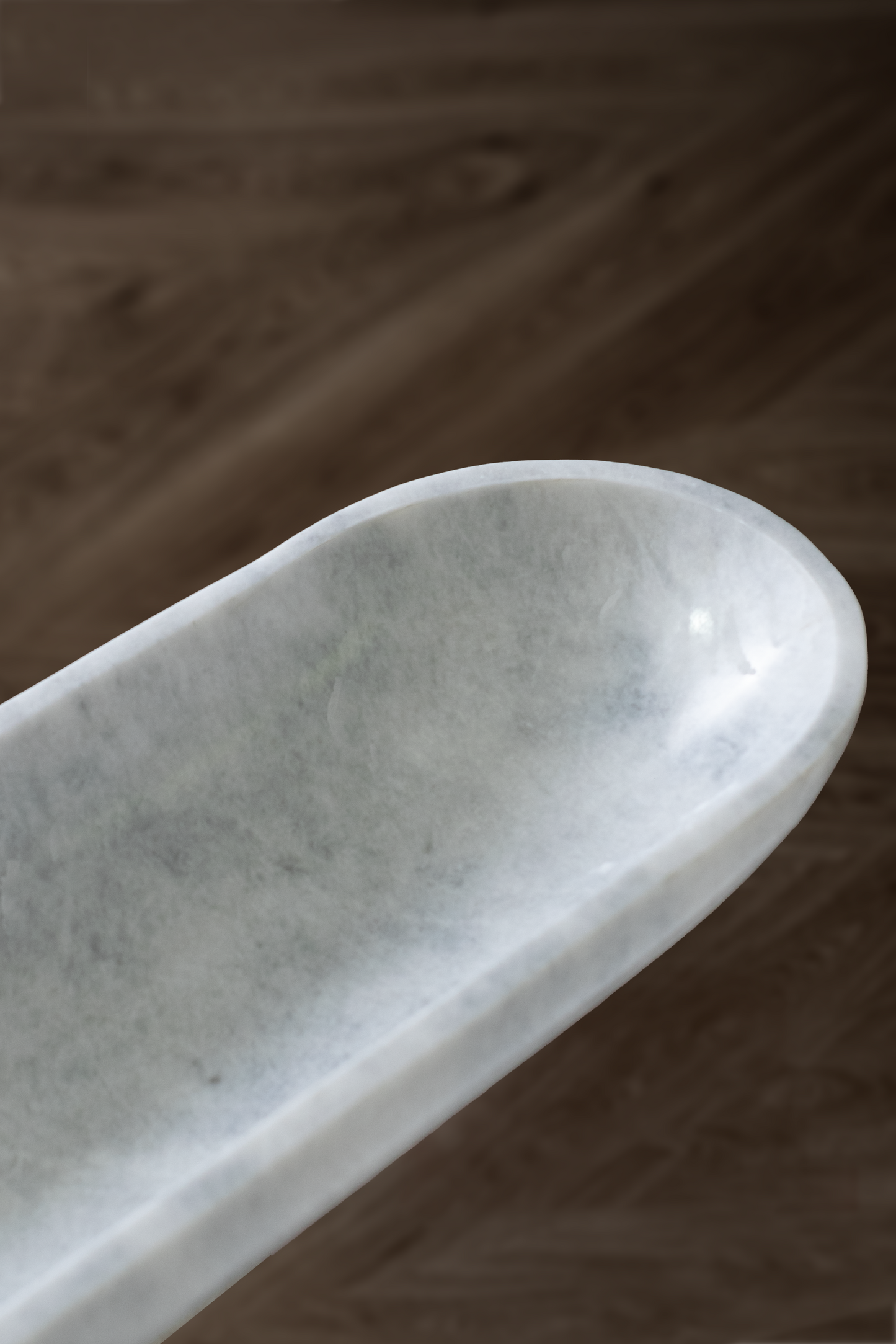 Handcrafted Serenity Oval Bowl in white marble, ideal for serving or decorative use.