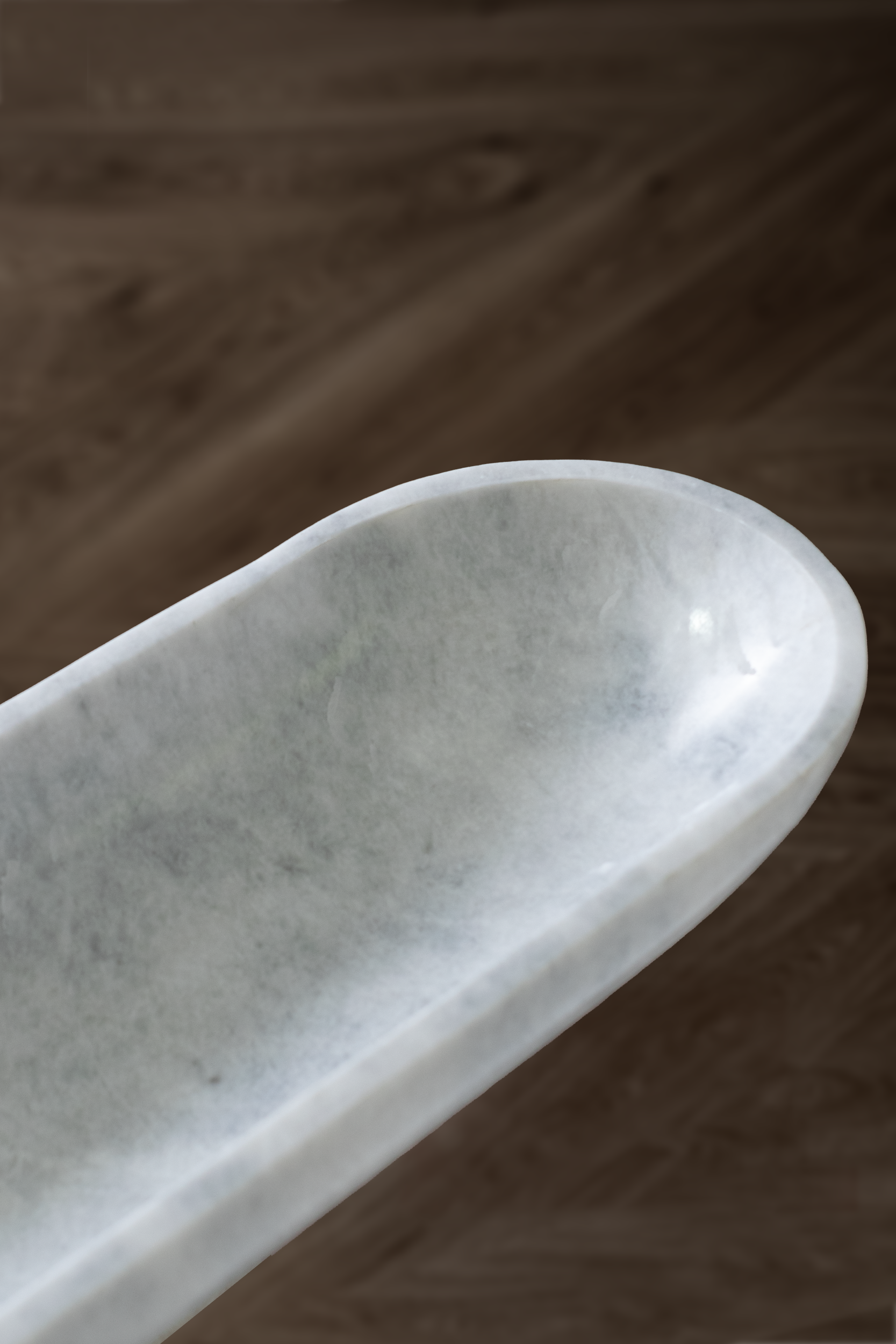 Handcrafted Serenity Oval Bowl in white marble, ideal for serving or decorative use.