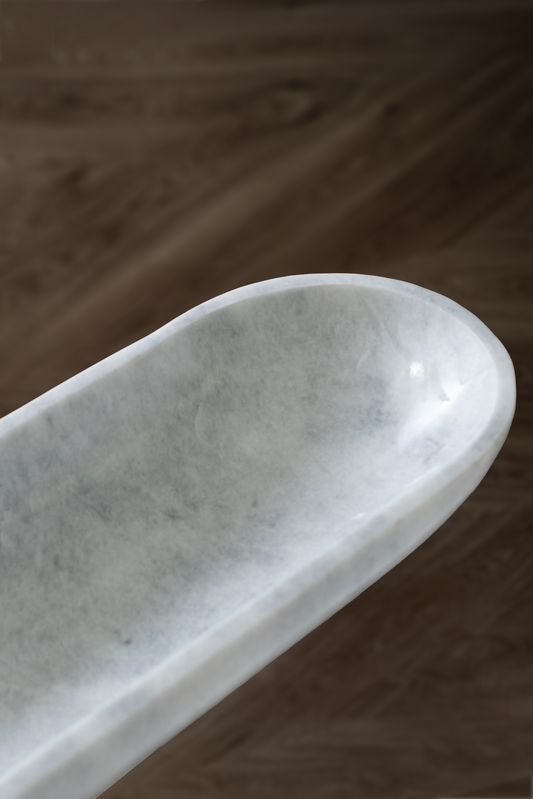 Handcrafted Serenity Oval Bowl in white marble, ideal for serving or decorative use.