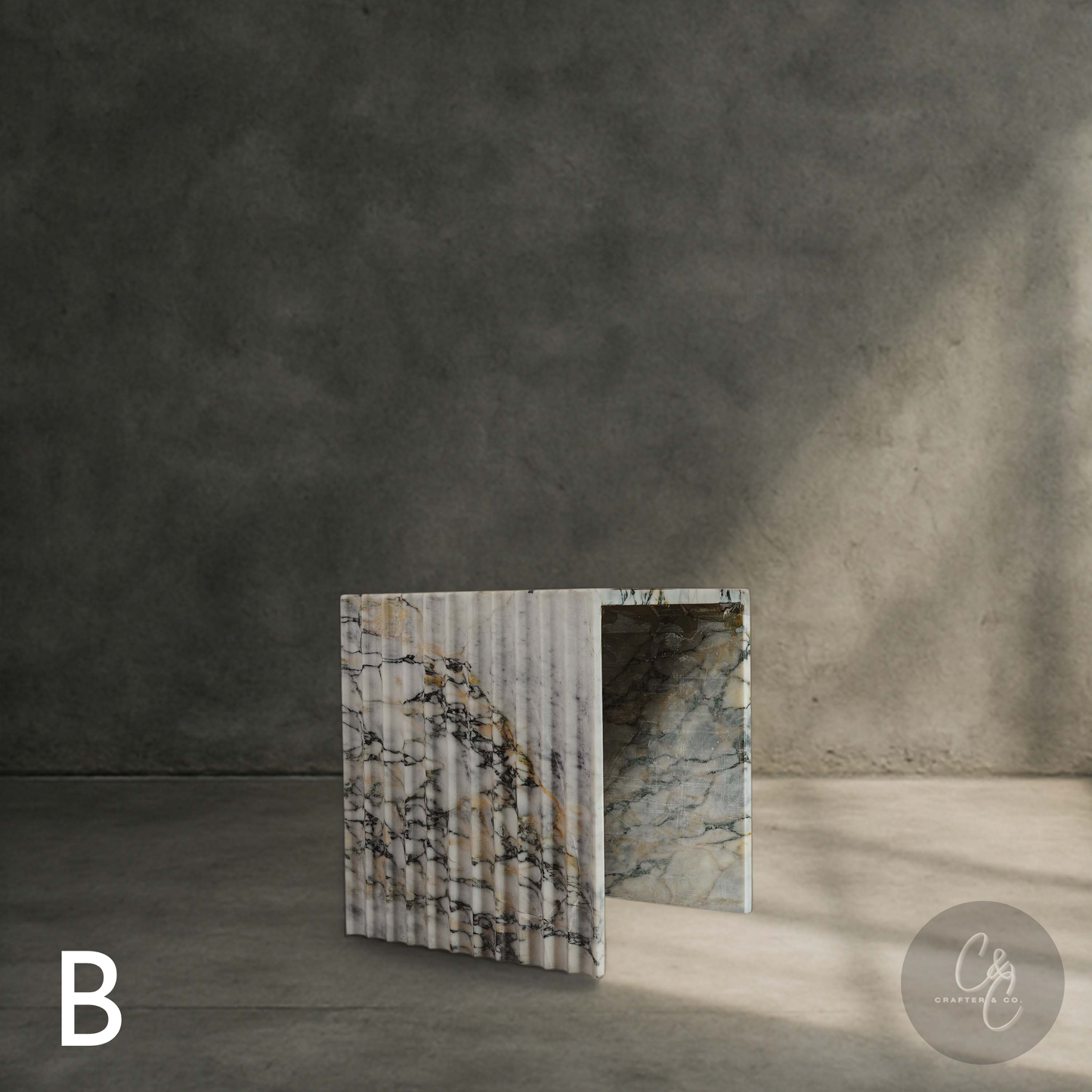 Arbescato Viola corrugated side table styled in modern interior with concrete wall. Aesthetic feel