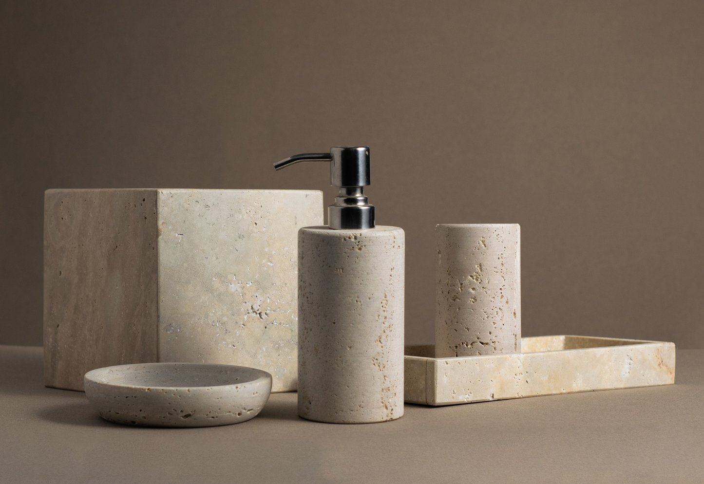 "Stylish toothbrush holder and bath accessories crafted from premium travertine."