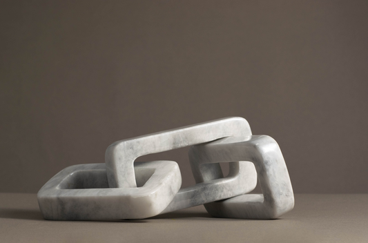 Sophisticated white marble link decorative piece, perfect for enhancing home décor.