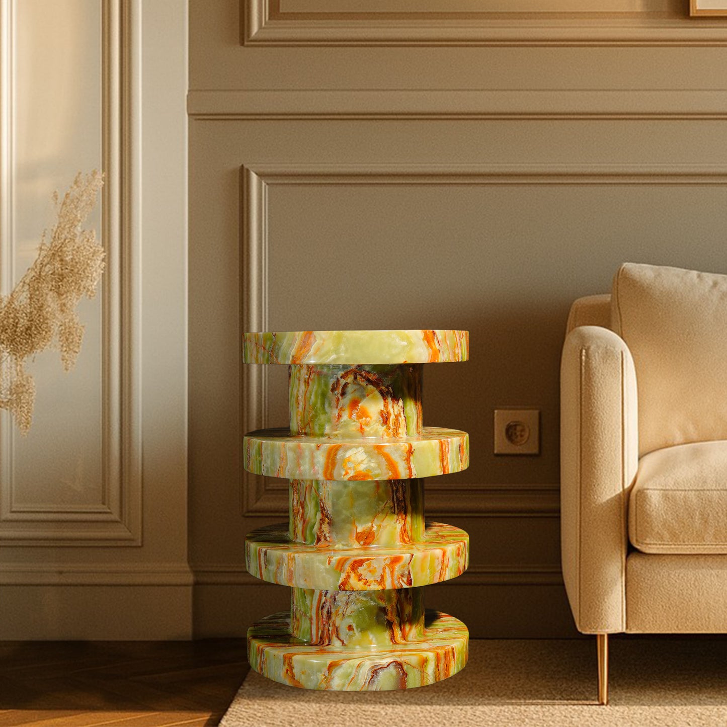 Vela Green Onyx Side Table styled beside a sofa, showcasing natural green onyx with rich green, gold and rust veining.