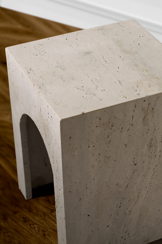 Close-up of the Arcadia Travertine Side Table highlighting natural travertine texture, soft tonal variation and handcrafted finish.