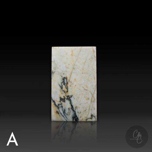 Front view of handcrafted Calacatta Monet marble column side table showcasing distinctive natural veining.