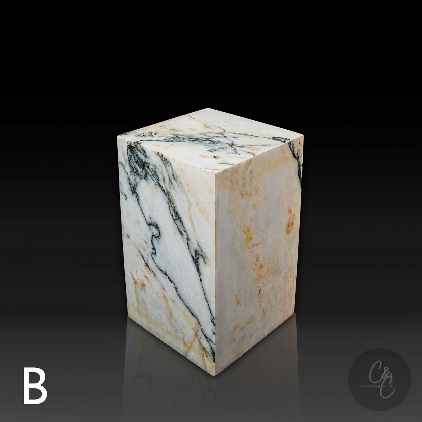 Top angled view of Calacatta Monet marble column side table featuring luxurious white marble with distinctive natural veining.