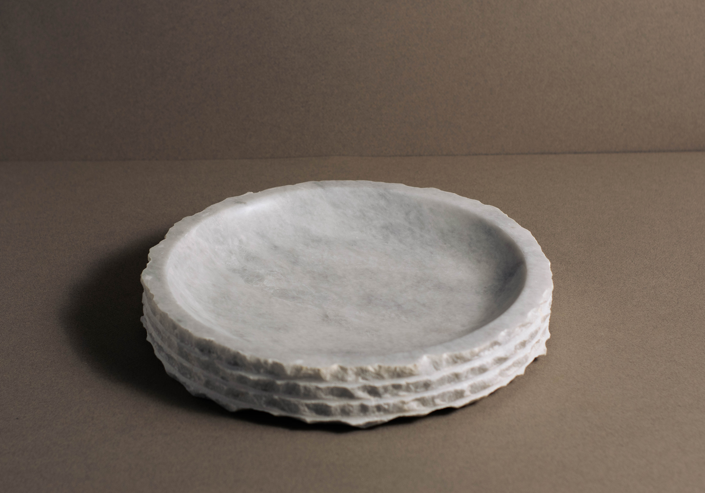 Eclipse White Marble Bowl displayed from a front angle highlighting its handcrafted layered marble design.