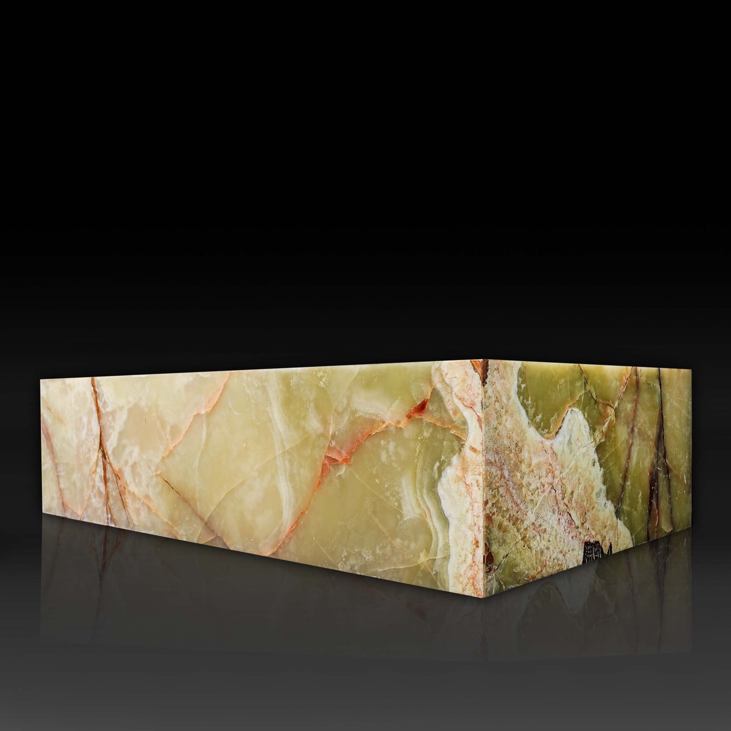 Corner view of the Large Block Green Onyx Coffee Table showcasing natural green onyx patterns and polished finish.