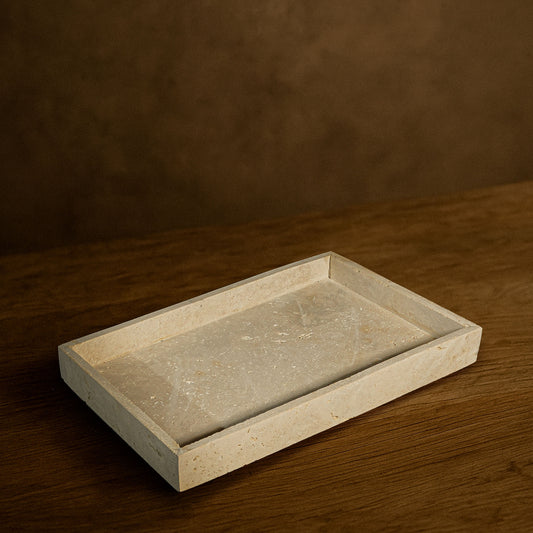 Front angle of the Oblong Travertine Tray showcasing its natural stone texture.