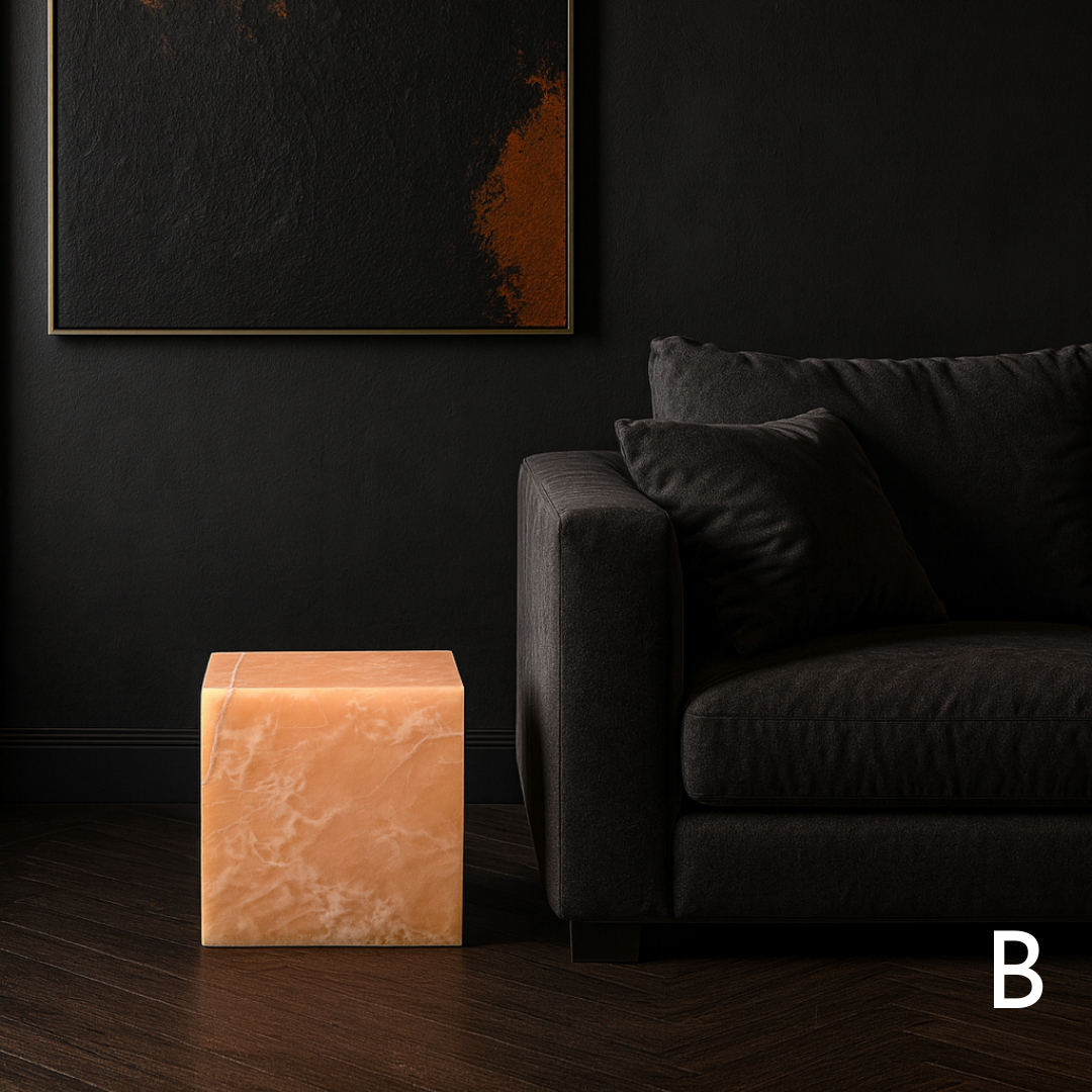 Orange onyx cube side table variation B styled beside a black sofa in a dark contemporary living room.