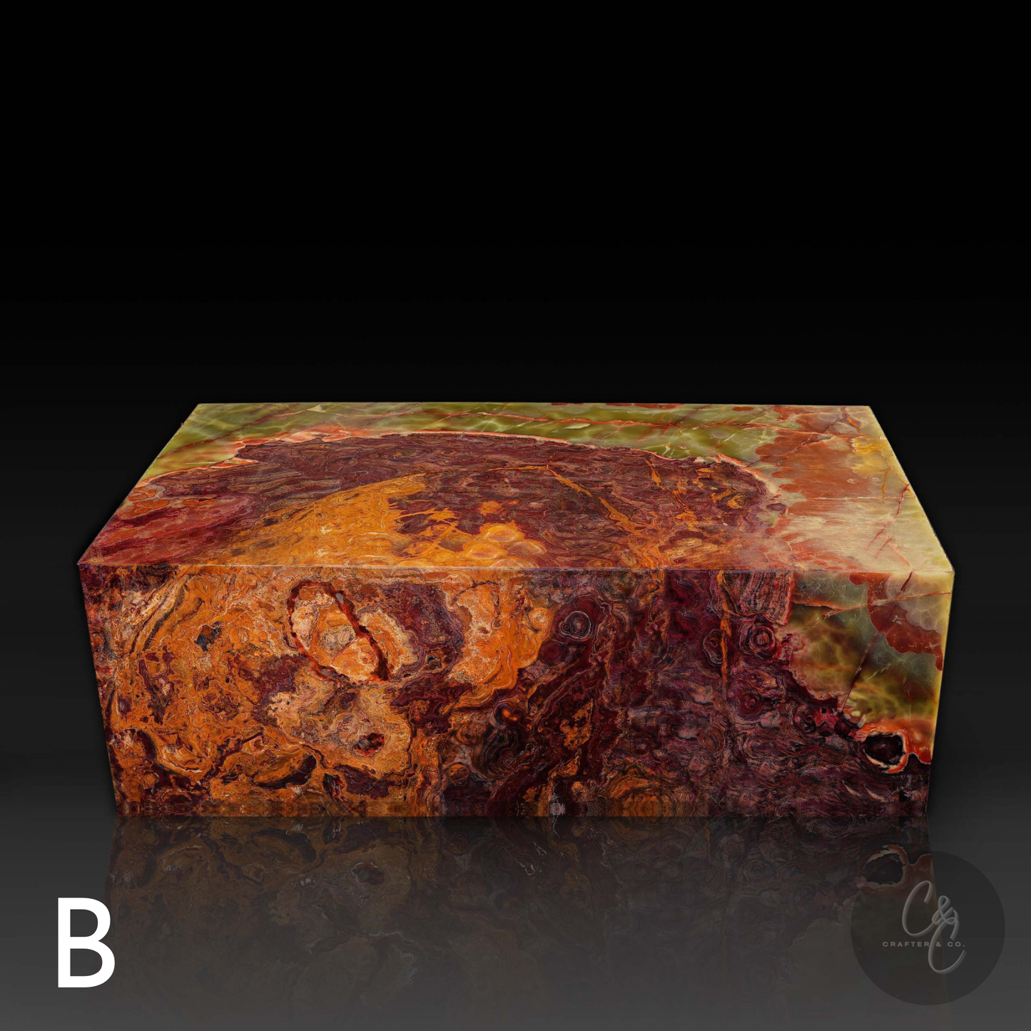 Front view of Small Block Green Onyx Coffee Table B handcrafted from polished natural green onyx with dramatic green rust amber and cream veining.