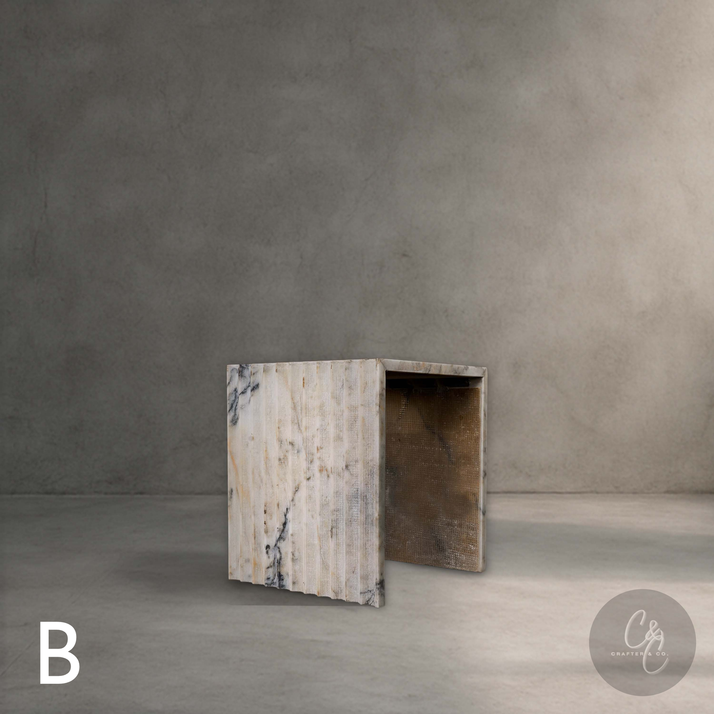 Calacatta Monet marble corrugated side table in aesthetic interior, luxury stone furniture