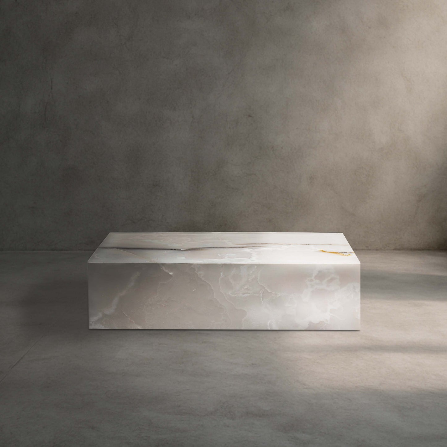 Large White Onyx block coffee table in polished natural stone.