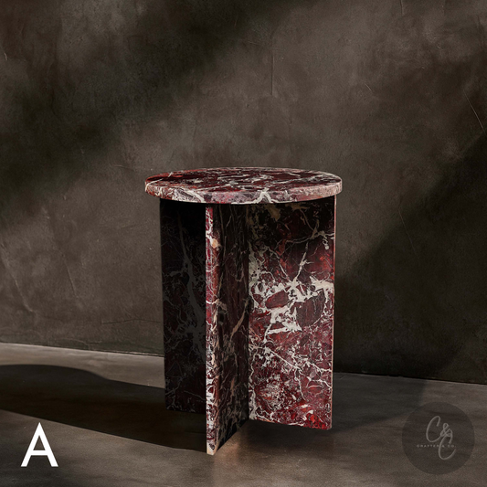 Round Cross Rosso Levanto marble side table angled view with honed finish