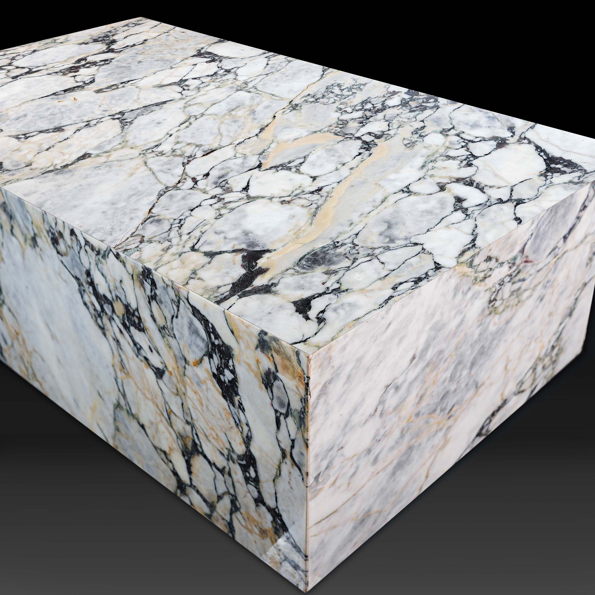 Angled view of the Small Block Coffee Table in Arabescato Viola Marble highlighting its natural stone veining.