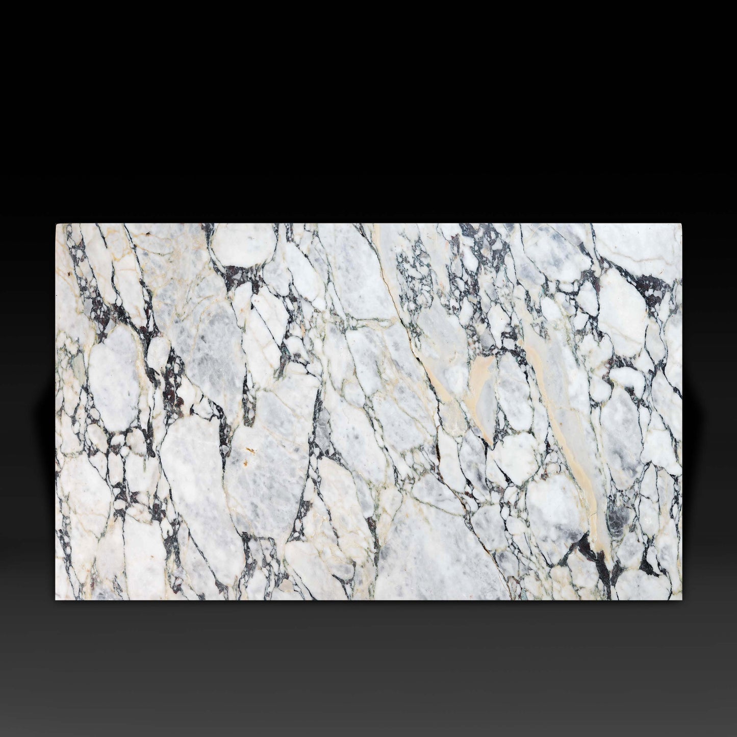 Top view of the Small Block Coffee Table in Arabescato Viola Marble showcasing its natural veining