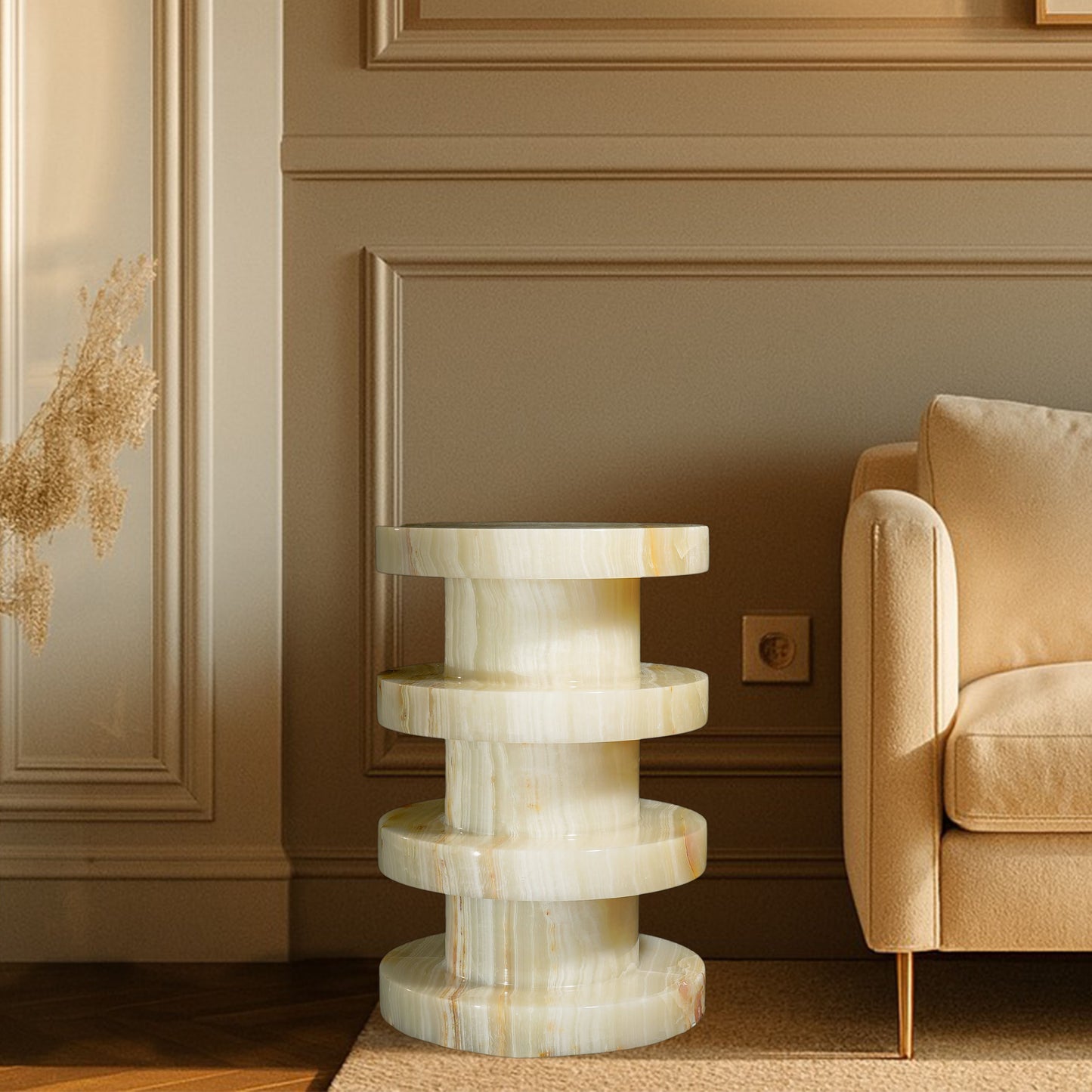 Vela White Onyx Side Table styled beside a sofa, showcasing natural white onyx, polished stone, and modern luxury interior design.