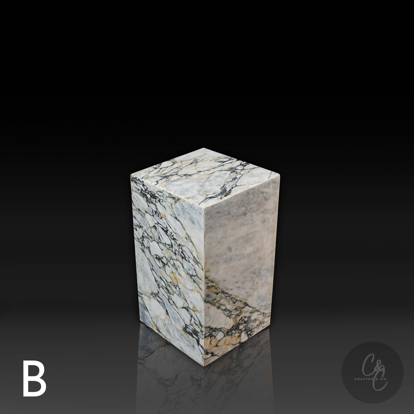 Top angle view of Arabescato Viola marble column side table Variant B with polished natural marble finish.