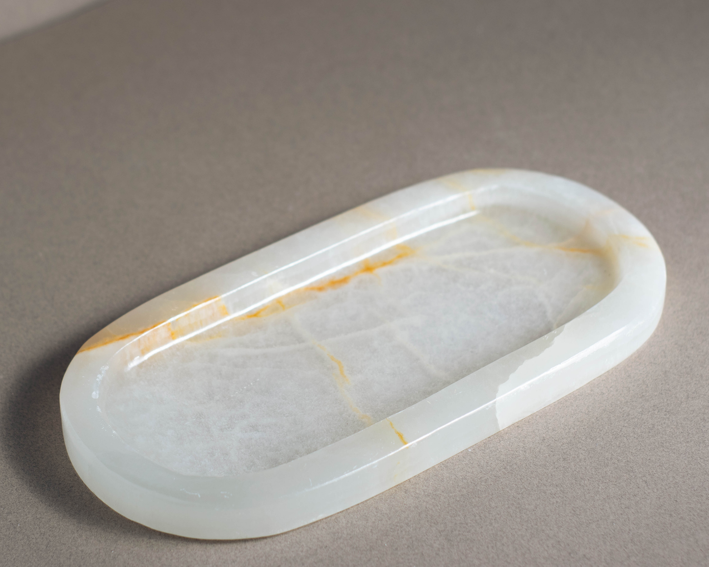 Aura White Onyx Tray handcrafted from natural White Onyx with soft ivory tones and delicate golden veining.