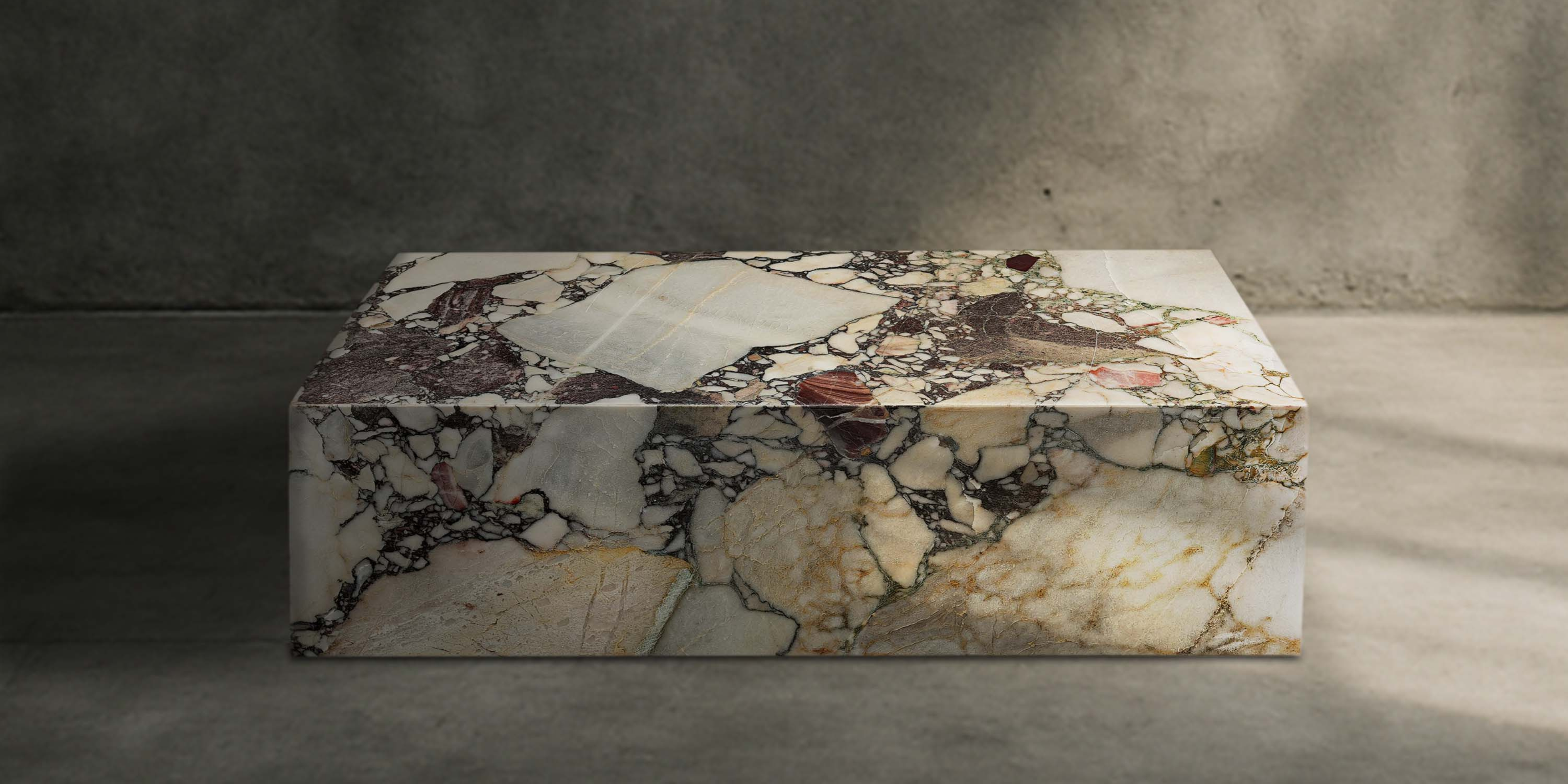 Luxury Breccia Capraia block coffee table handcrafted from natural stone.