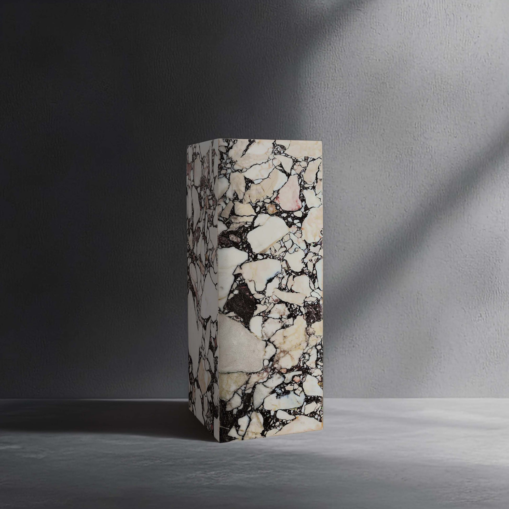 Breccia Capraia marble plinth handcrafted from natural stone.