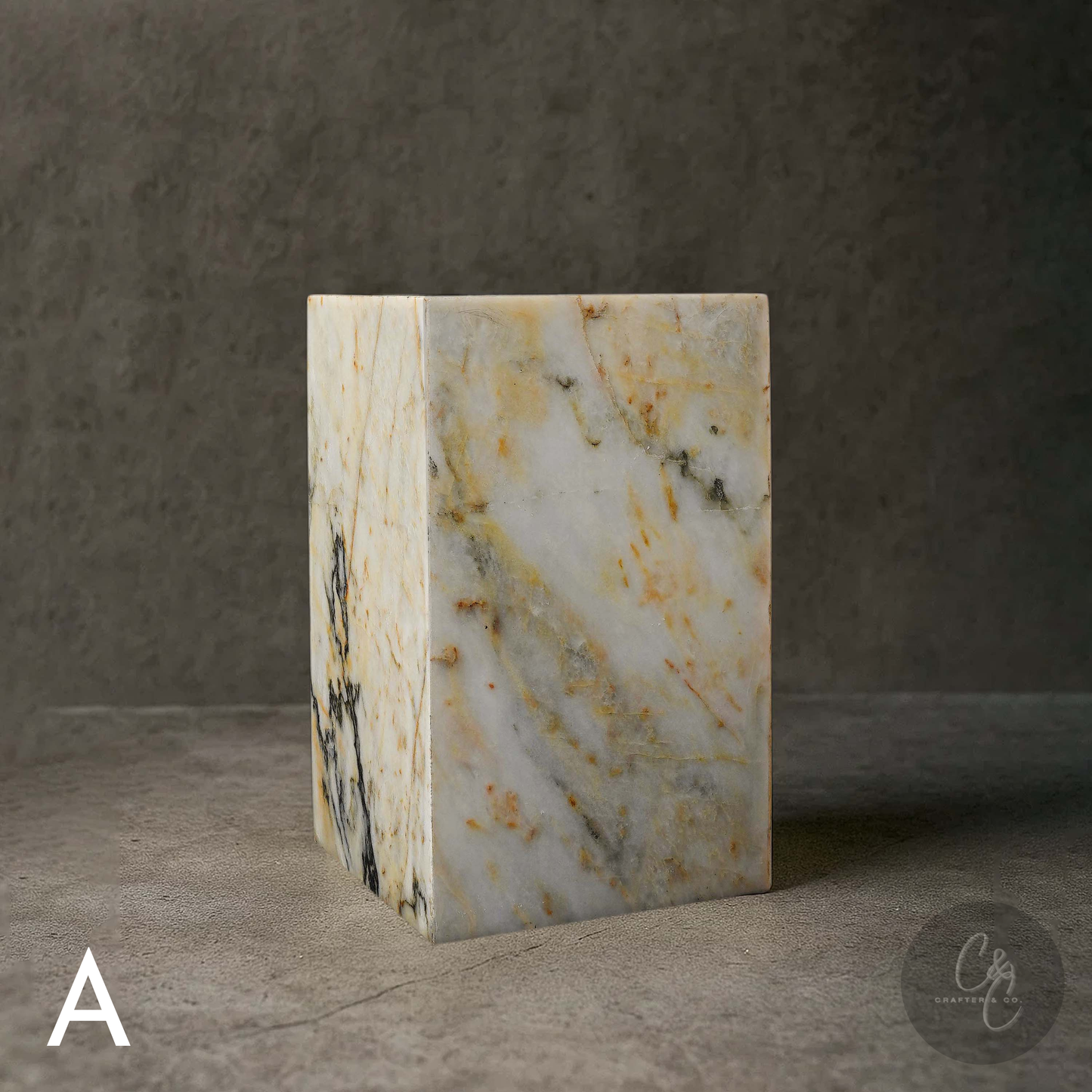 Calacatta Monet marble column side table with elegant gold, grey and charcoal veining for luxury contemporary interiors.