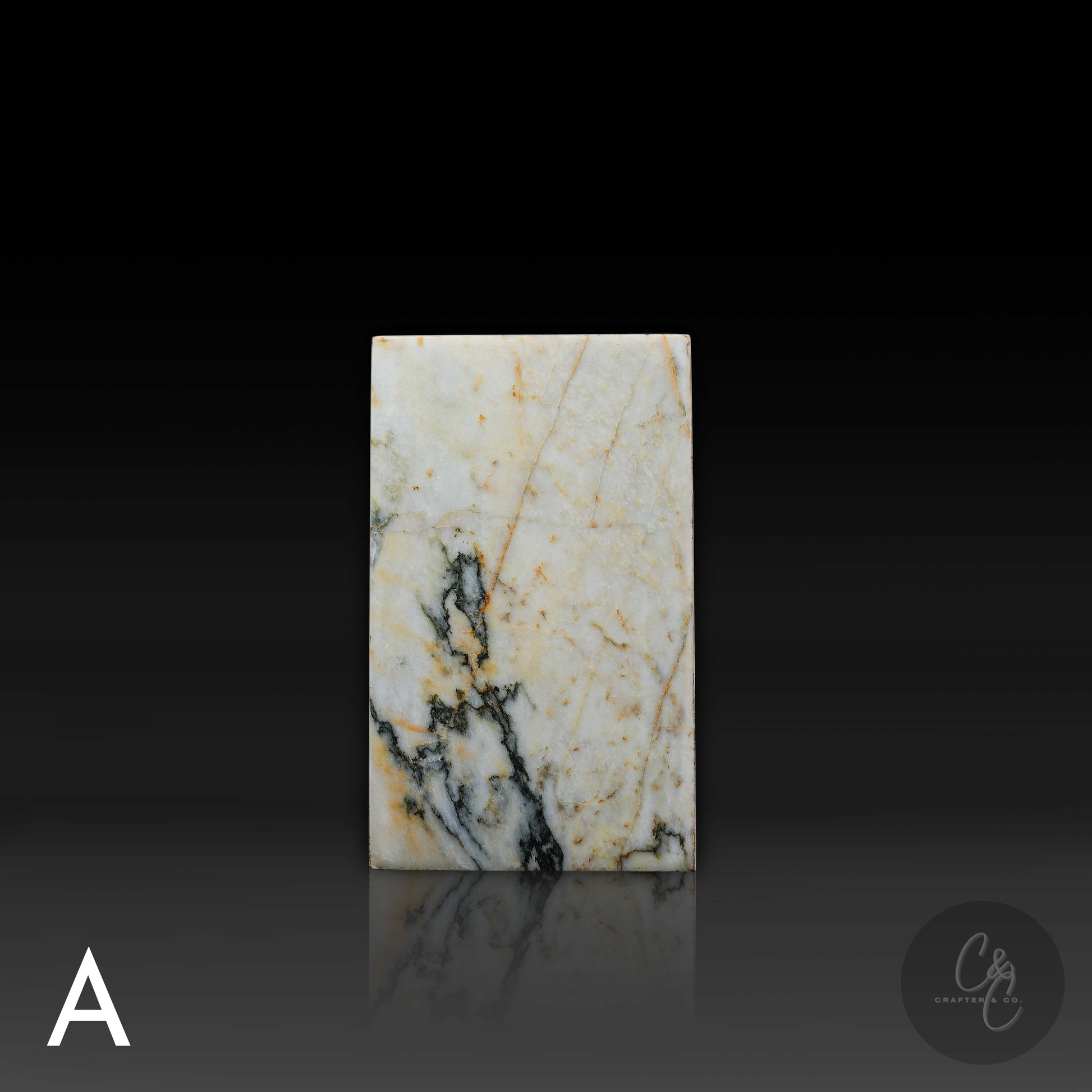 Front view of handcrafted Calacatta Monet marble column side table showcasing distinctive natural veining.