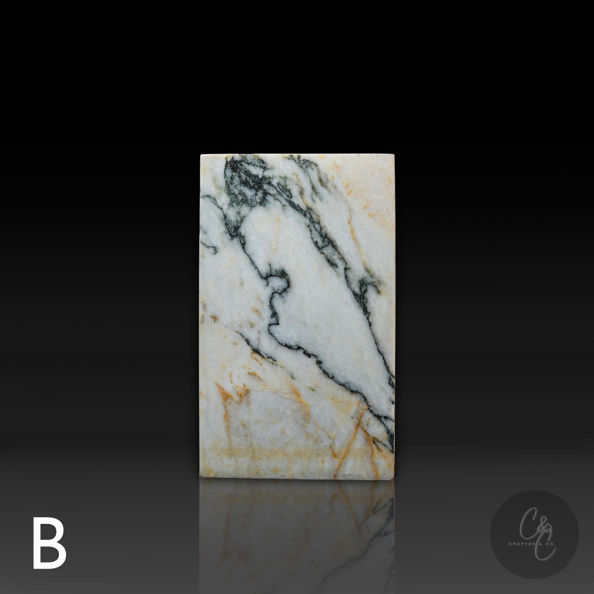 Front view of Calacatta Monet marble column side table showcasing striking natural marble veining and elegant proportions.