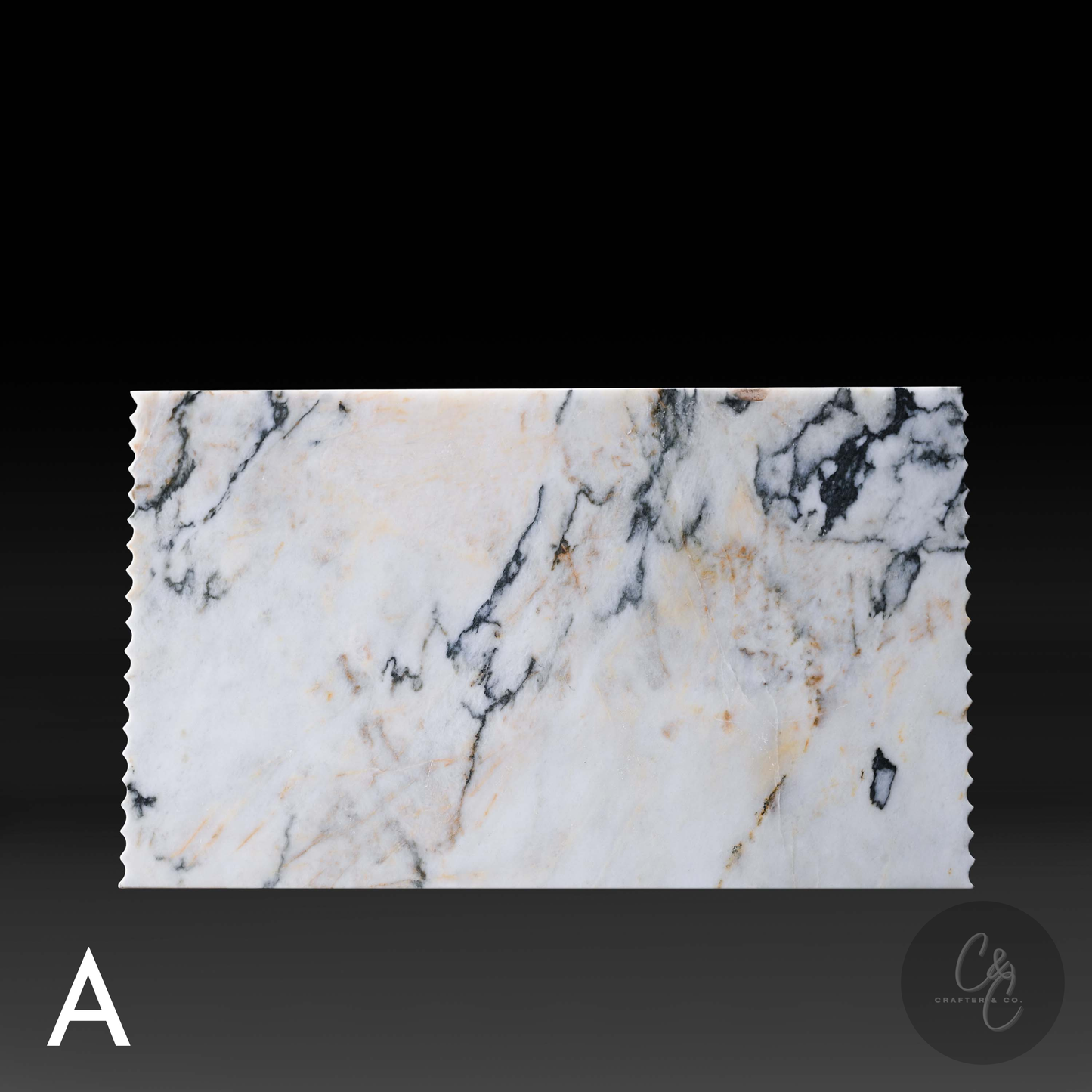 Top view of Calacatta Monet marble showcasing natural black, green and gold veining.