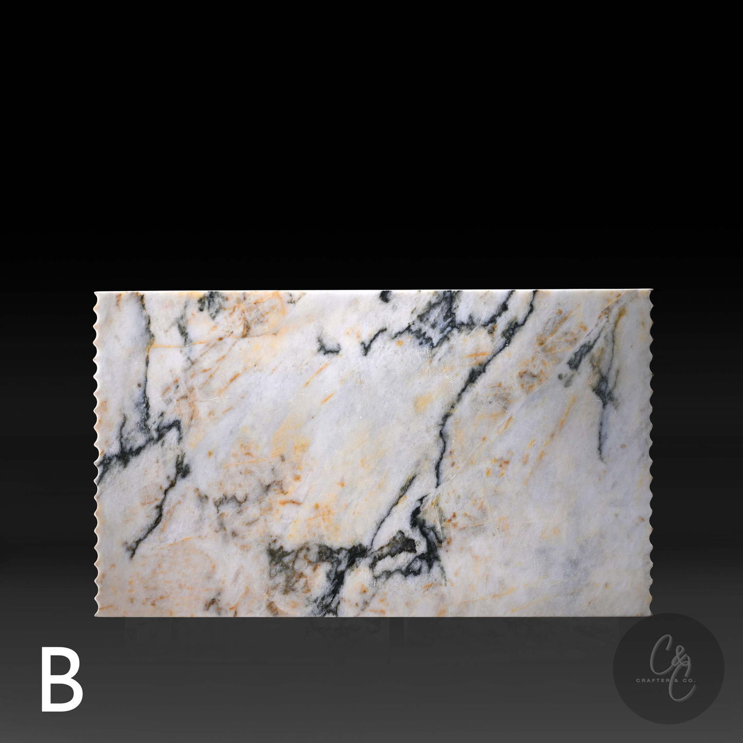 Top view of Calacatta Monet marble variant B showcasing natural black, grey and gold veining.