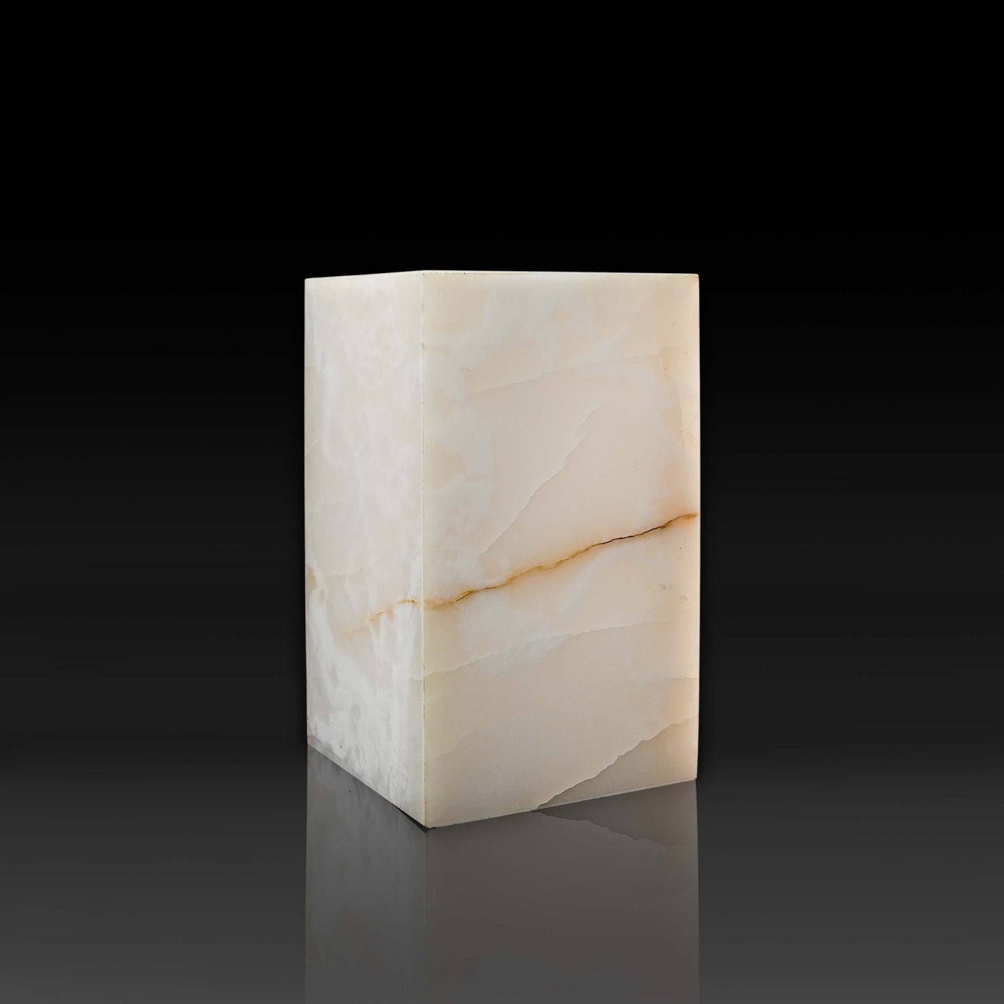 Front profile of the handcrafted White Onyx column side table highlighting polished natural stone and soft ivory tones.