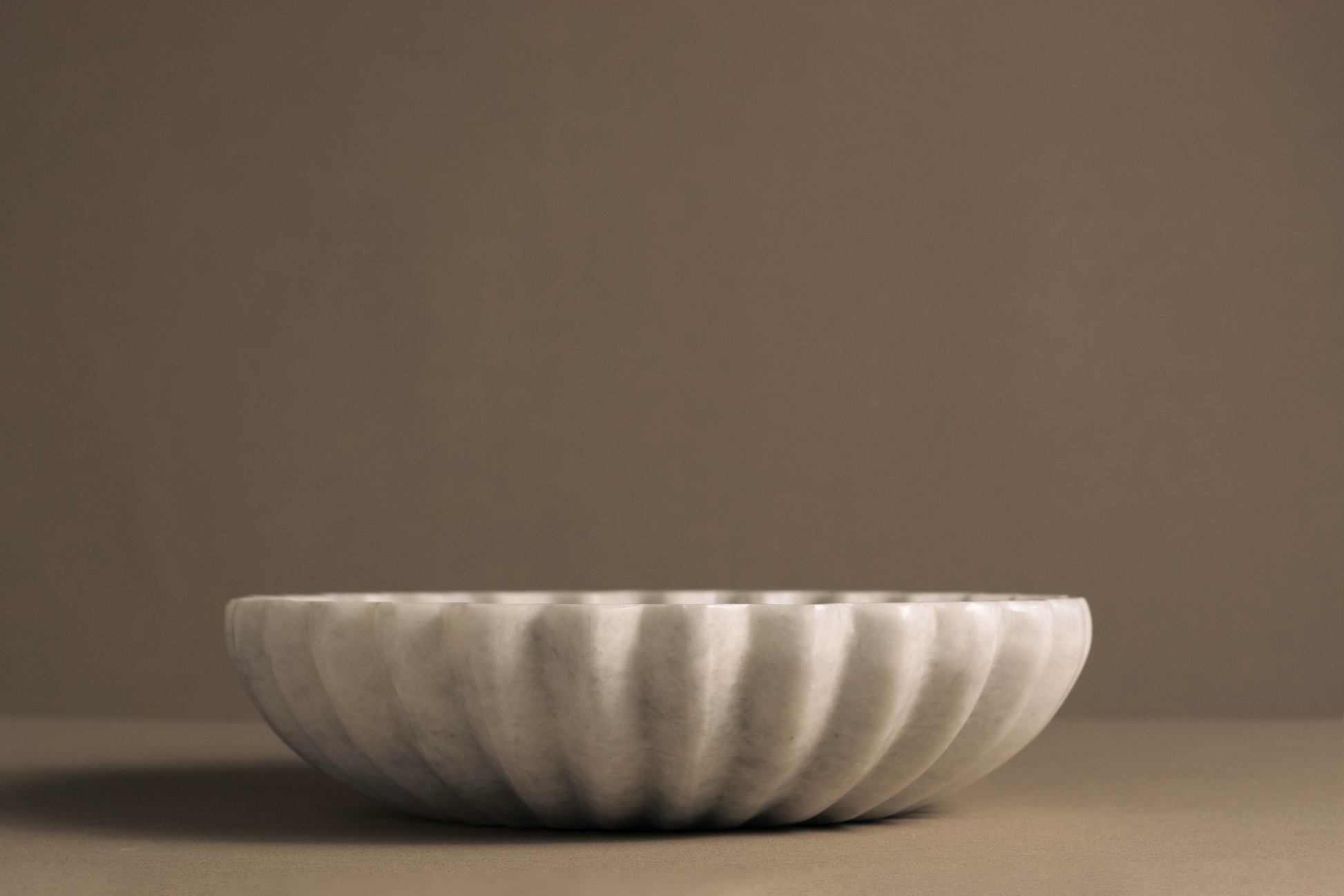 Coral White Marble Bowl handcrafted from natural white marble with a sculptural fluted design.