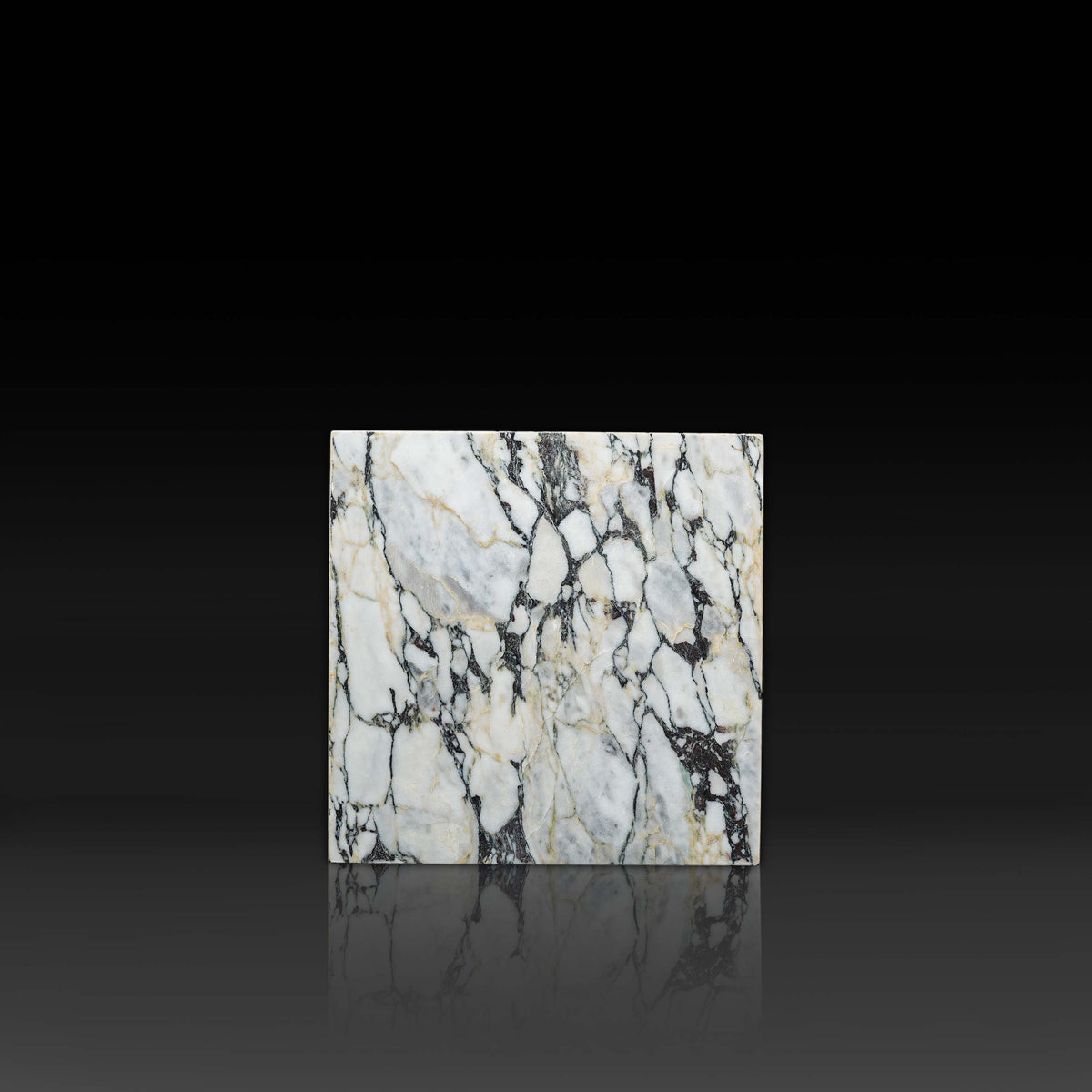 Front view of the Arabescato Viola Cube Side Table highlighting bold natural marble veining.
