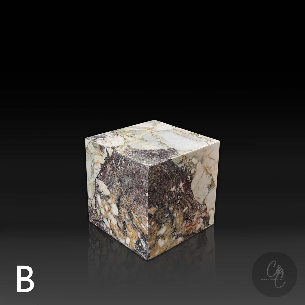 Cube Side Table in Breccia Capraia marble front angle showcasing distinctive natural veining and rich colour variation.