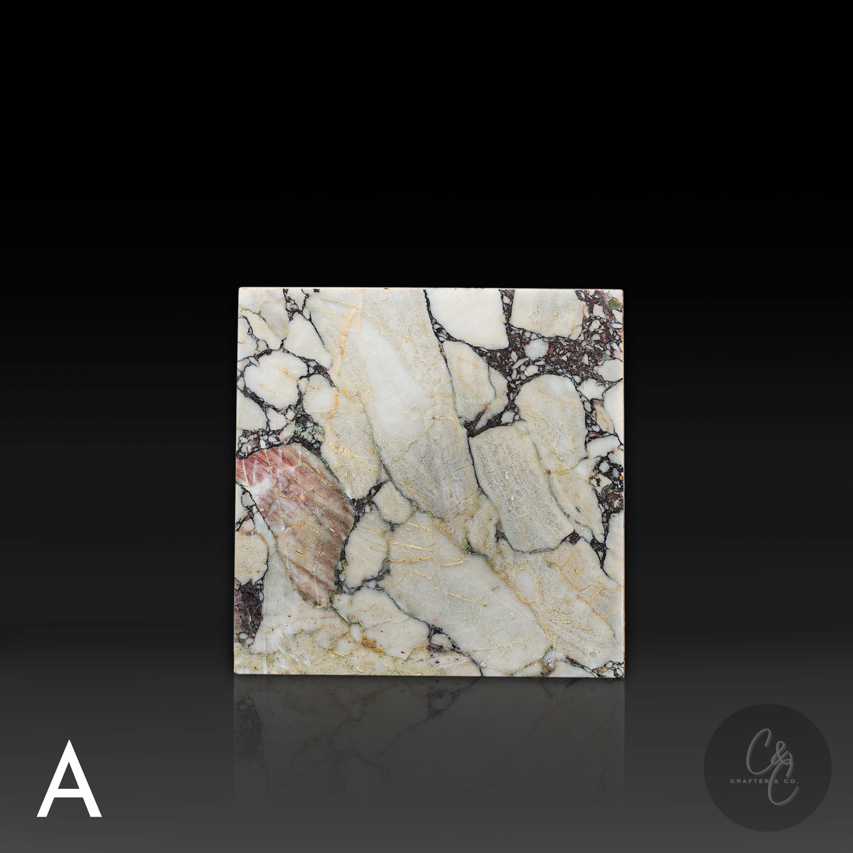 Cube Side Table in Breccia Capraia marble front view highlighting dramatic natural stone patterns.