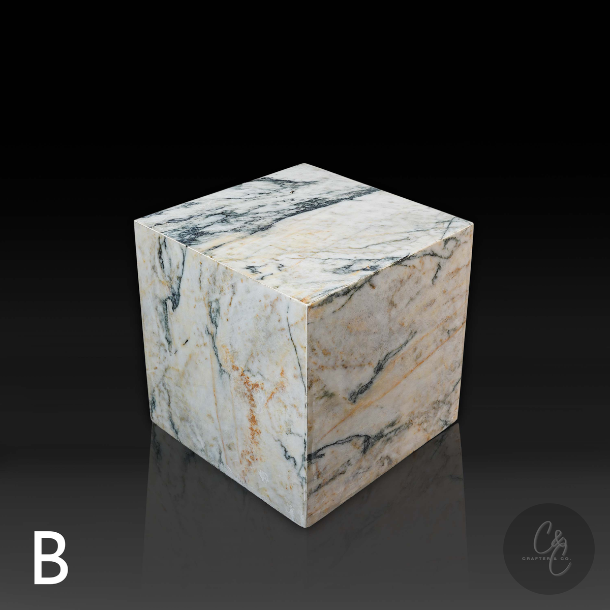 Cube Side Table in Calacatta Monet marble front angle highlighting unique natural stone patterns.