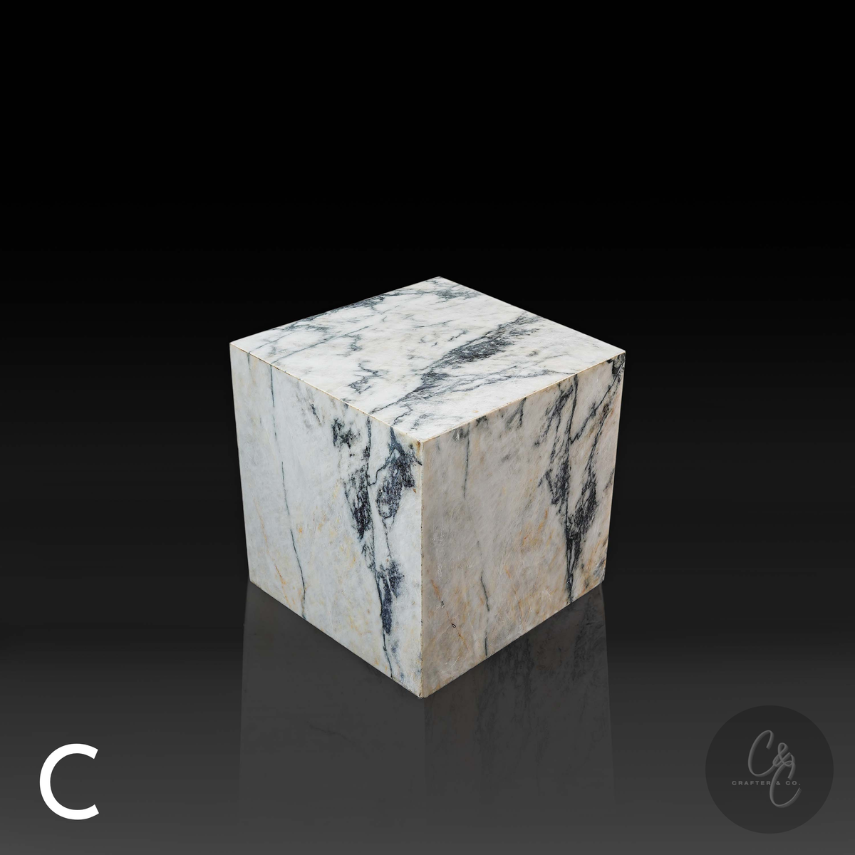 Cube Side Table in Calacatta Monet marble front angle highlighting unique natural stone patterns.