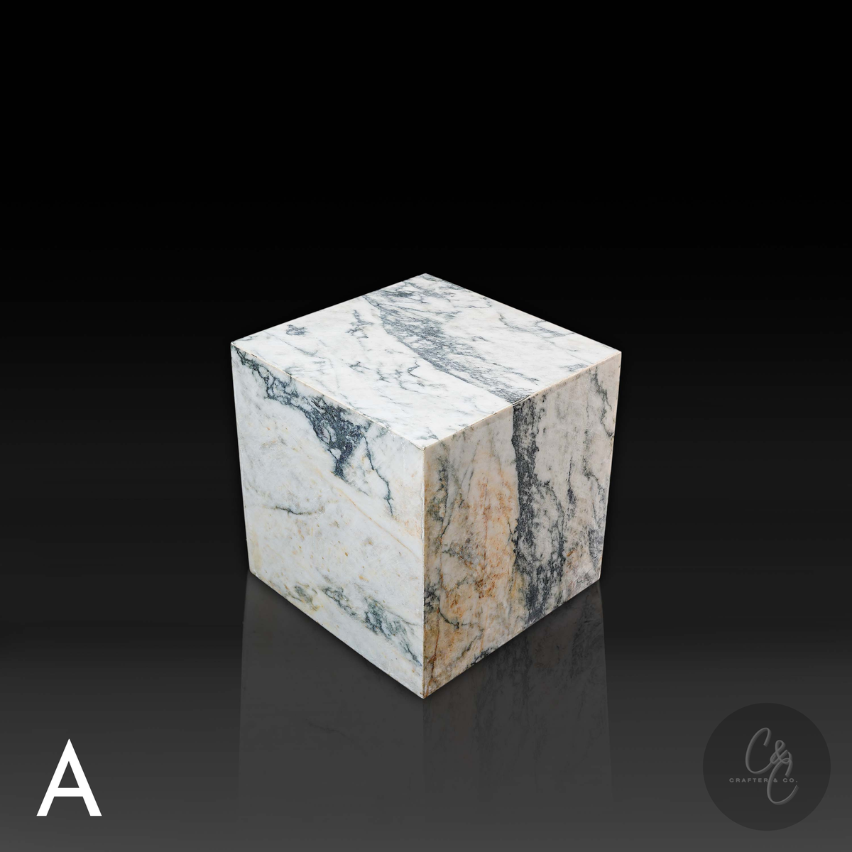 Cube Side Table in Calacatta Monet marble front angle highlighting unique natural stone patterns.