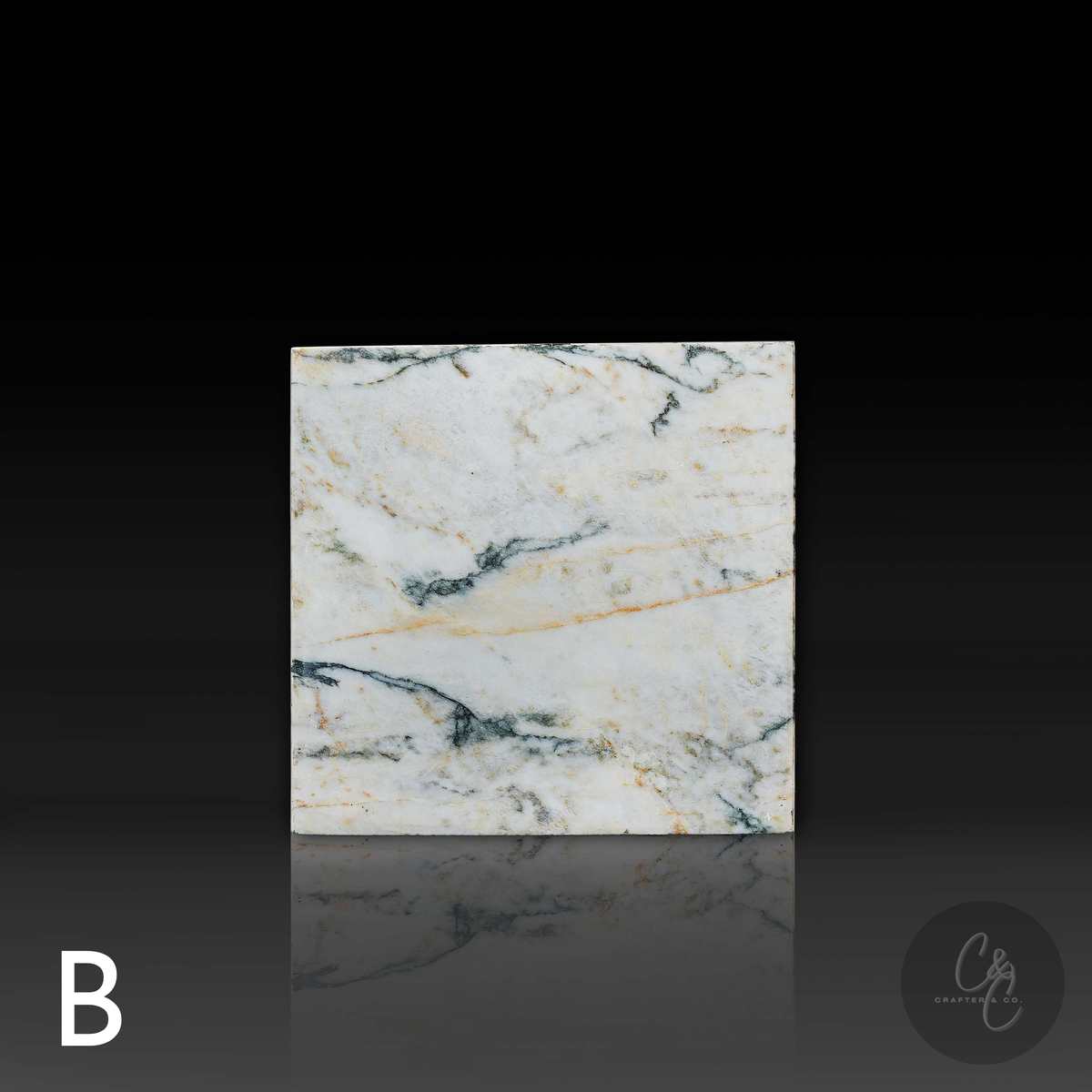 Cube Side Table in Calacatta Monet marble front view with distinctive natural stone veining
