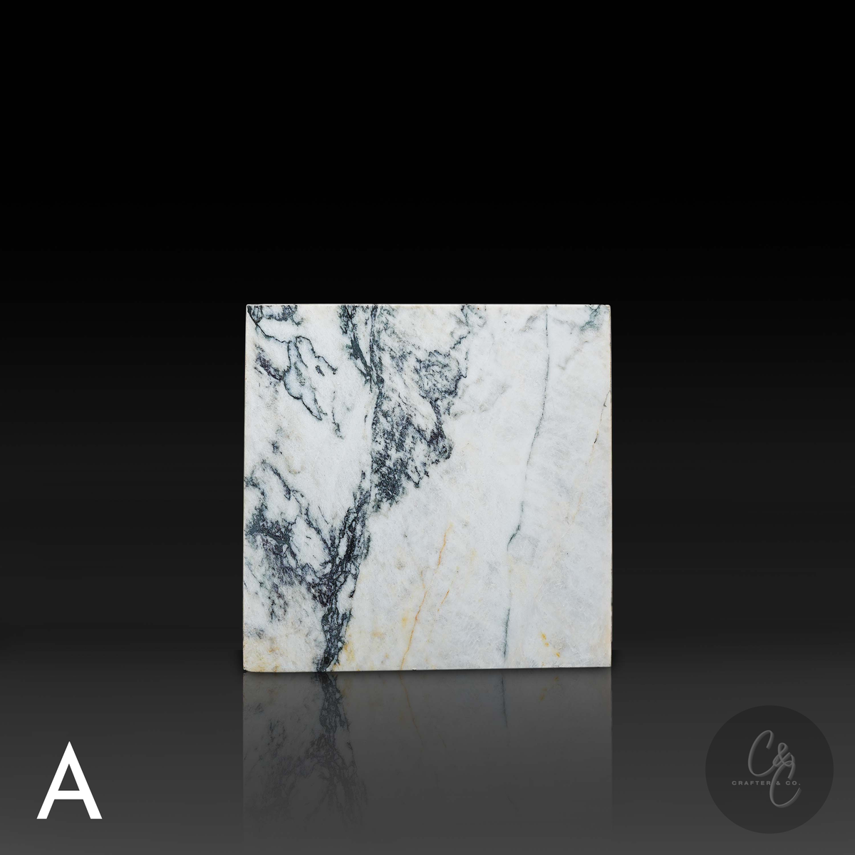 Cube Side Table in Calacatta Monet marble front view showcasing bold natural veining