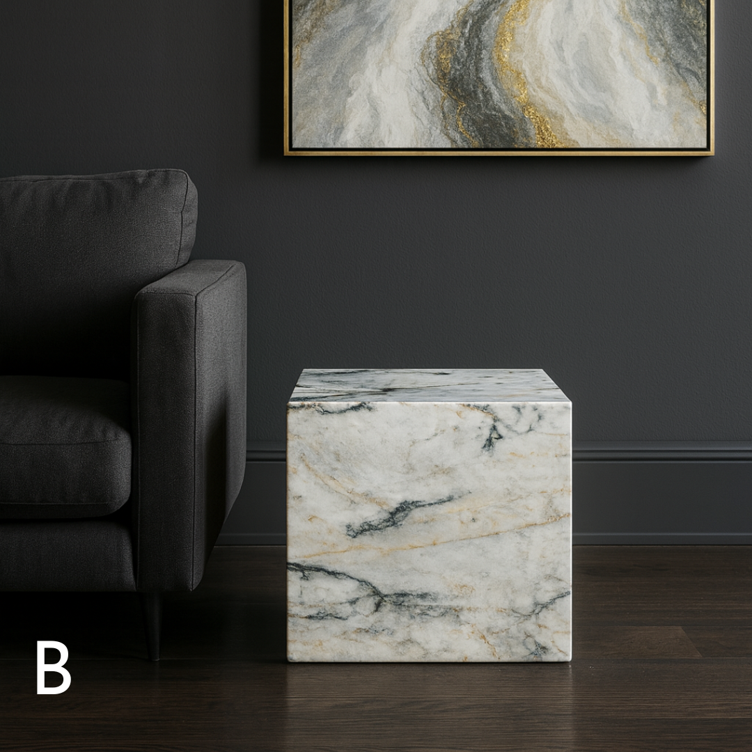 Cube Side Table in Calacatta Monet marble styled beside a charcoal sofa in a contemporary living room.