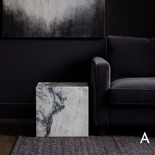 Cube Side Table in Calacatta Monet marble styled beside a charcoal sofa in a modern living room