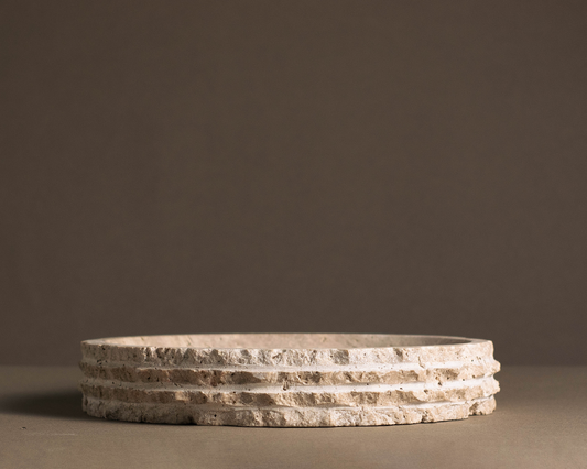Eclipse Travertine Bowl handcrafted from natural travertine featuring a layered sculptural edge and warm earthy tones.