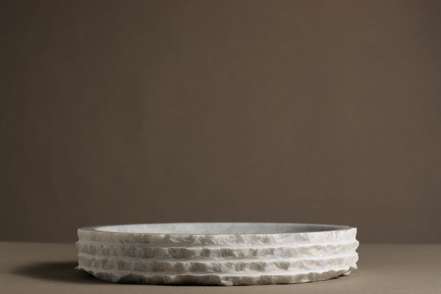 Eclipse White Marble Bowl handcrafted from natural white marble with a layered sculptural edge.