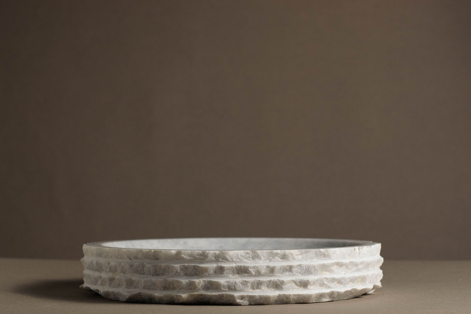 Eclipse White Marble Bowl handcrafted from natural white marble with a layered sculptural edge.